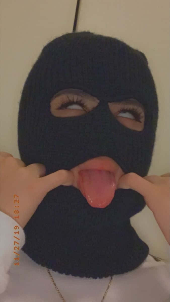 Baddie Ski Mask Tongue Out Pose.jpg Wallpaper