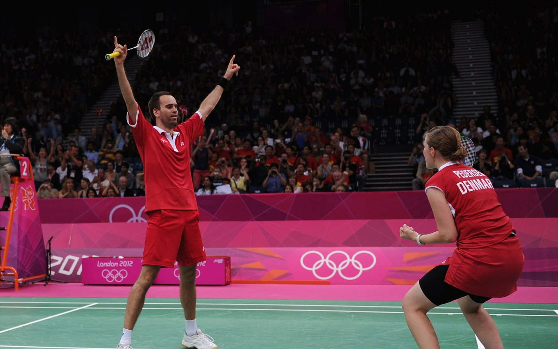 Dynamic Action as Female Badminton Player Strikes the Shuttlecock