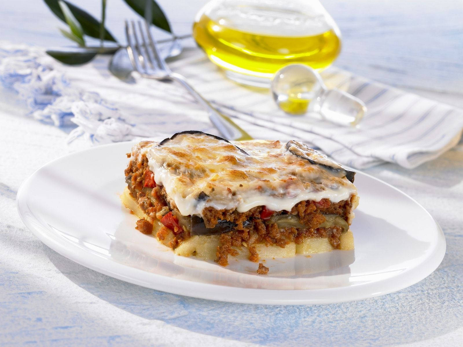 Delicious Baked Moussaka Topped with Creamy Meat Sauce Wallpaper