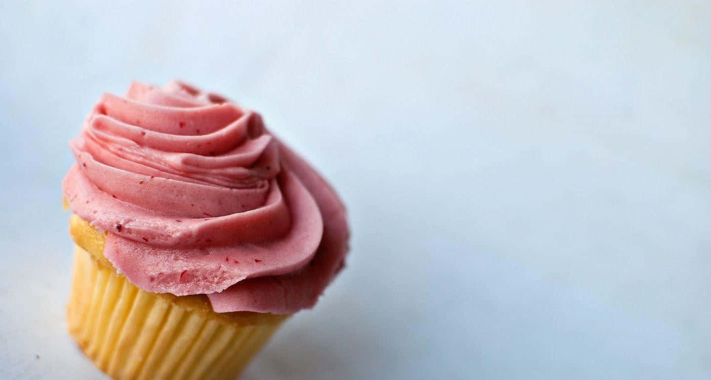 A Pink Cupcake With Frosting