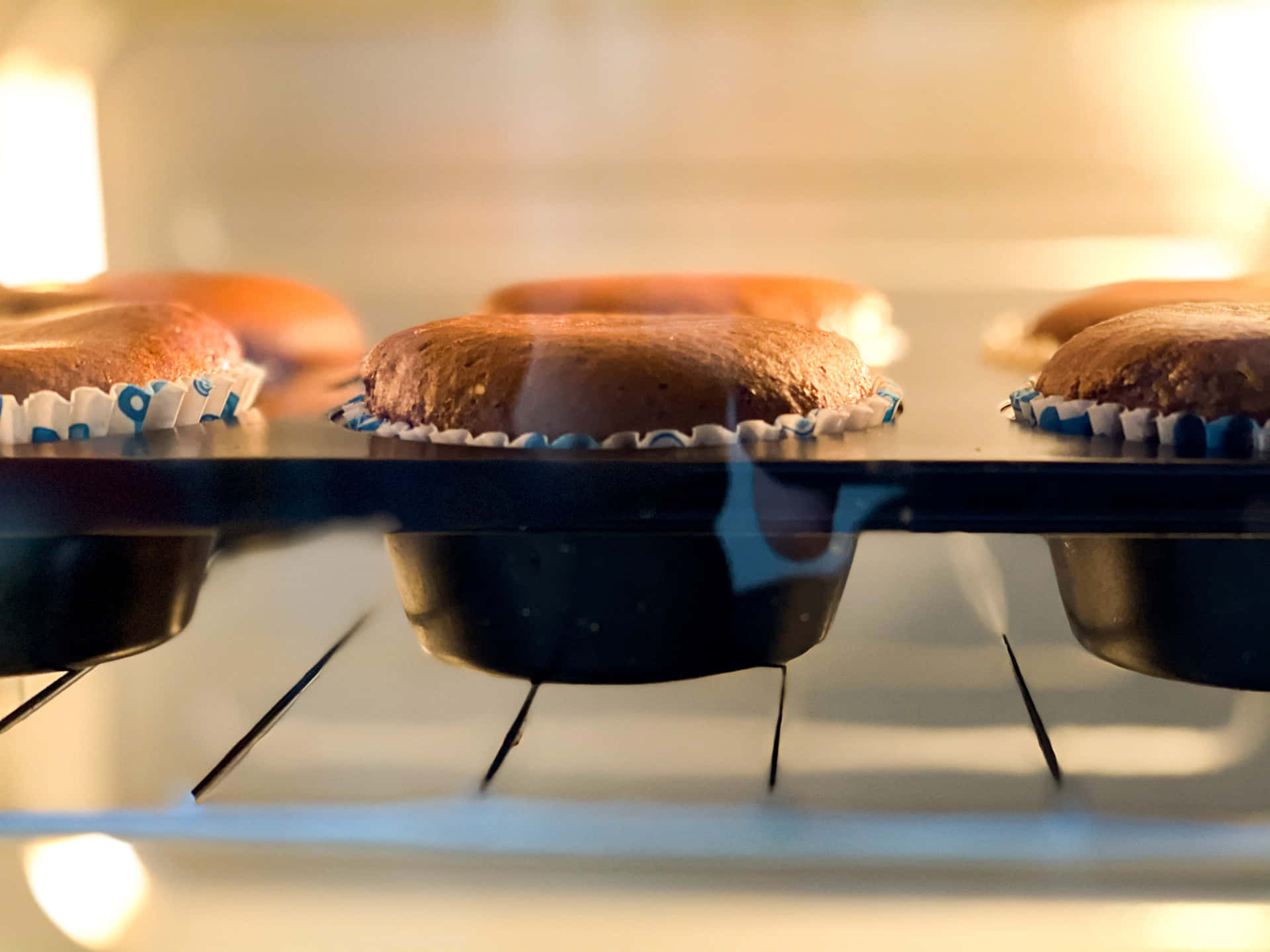 A Group Of Cupcakes In An Oven