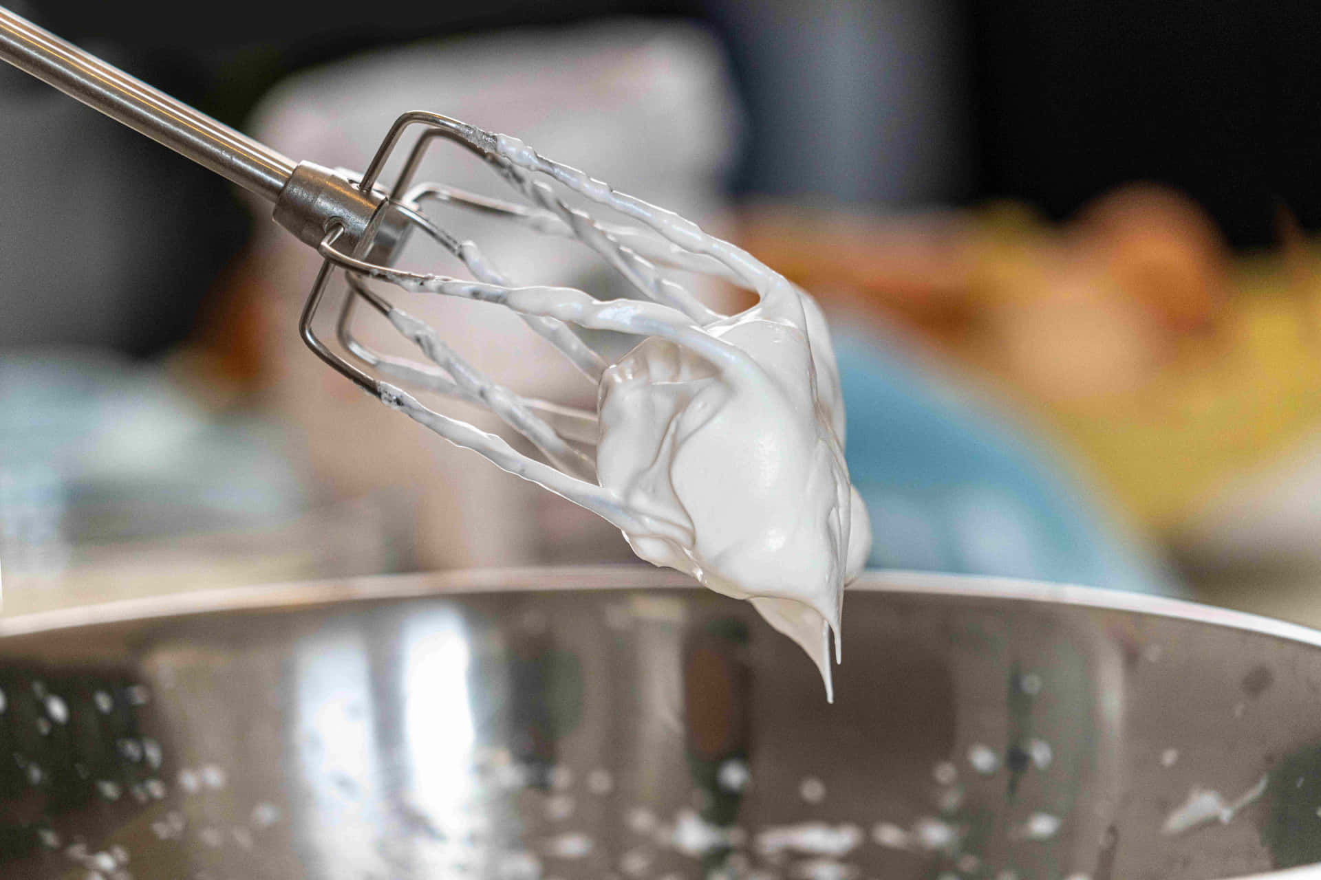 A Whisk Is Being Used To Mix A White Liquid