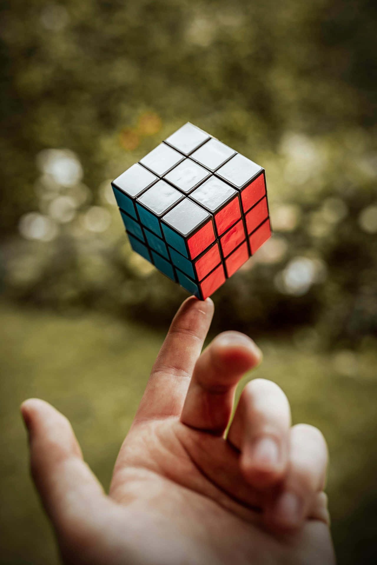 Balanced Rubiks Cubeon Fingertip.jpg Wallpaper