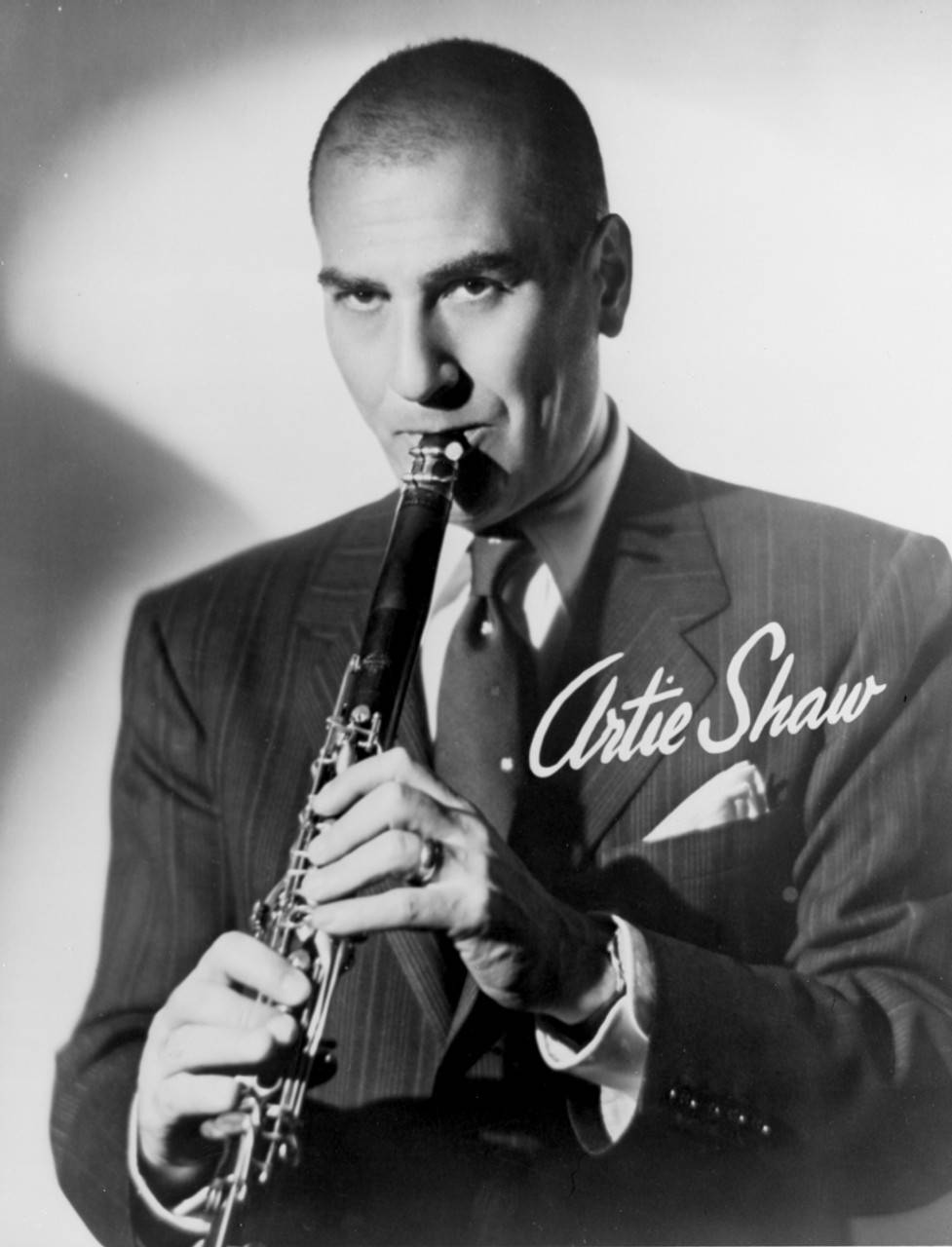 Bald Artie Shaw Playing Clarinet In Greyscale Wallpaper