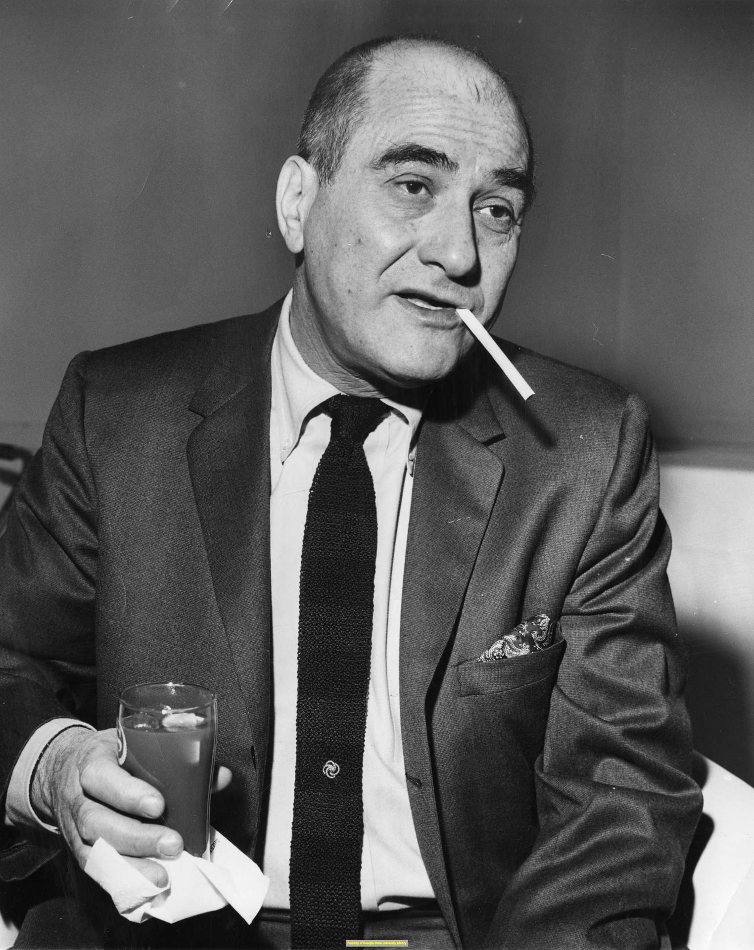 Legendary Jazz Musician Artie Shaw Pensively Smoking a Cigarette Wallpaper