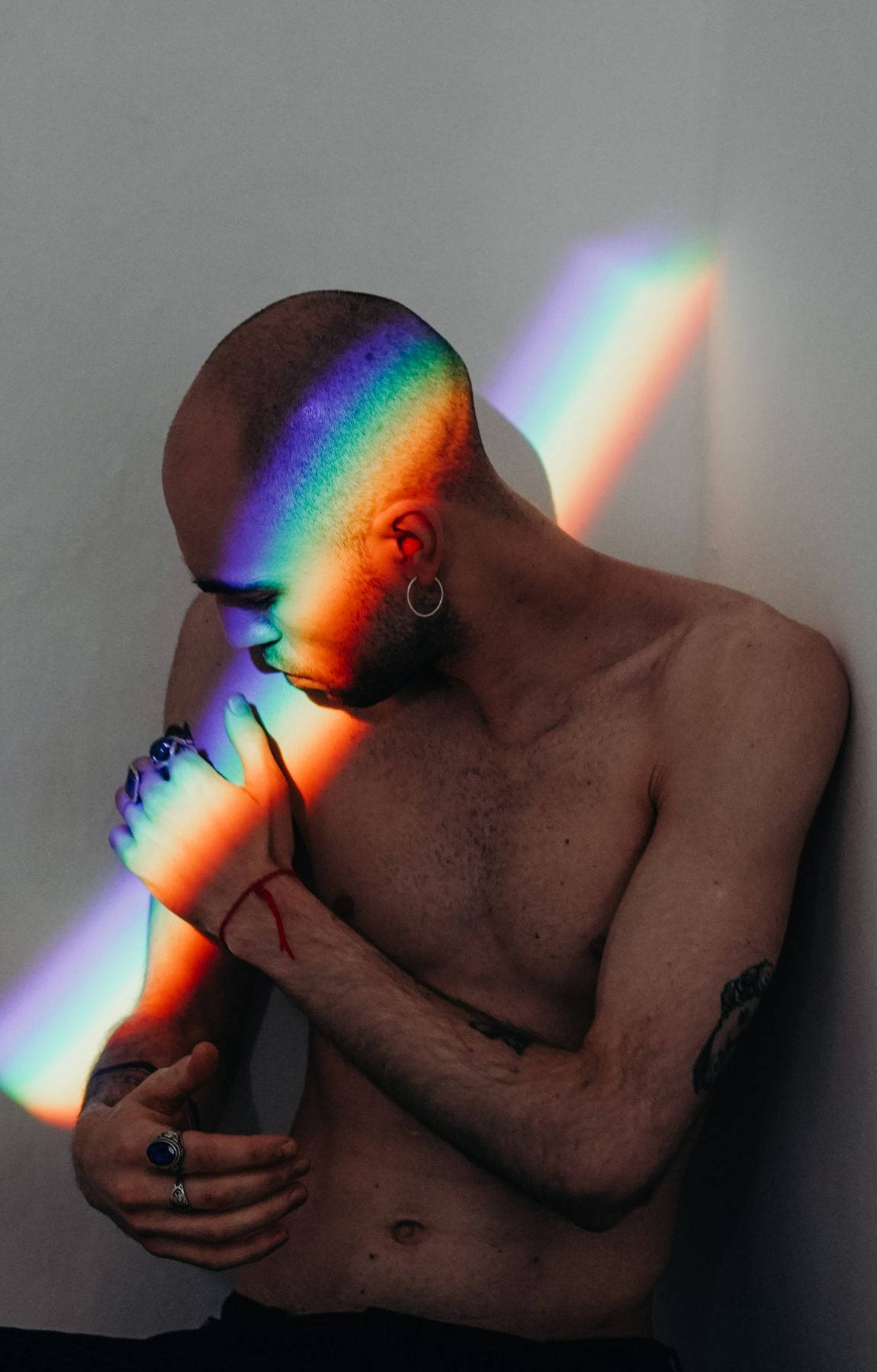 Bald Man Against A Rainbow Ray Of Light Picture
