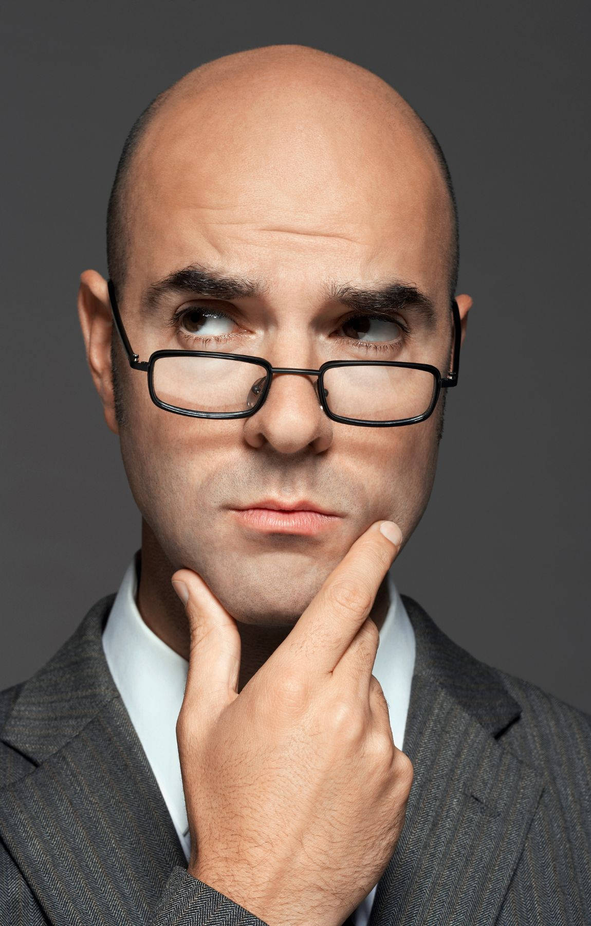Portrait of a Mature Bald Man in Glasses Wallpaper