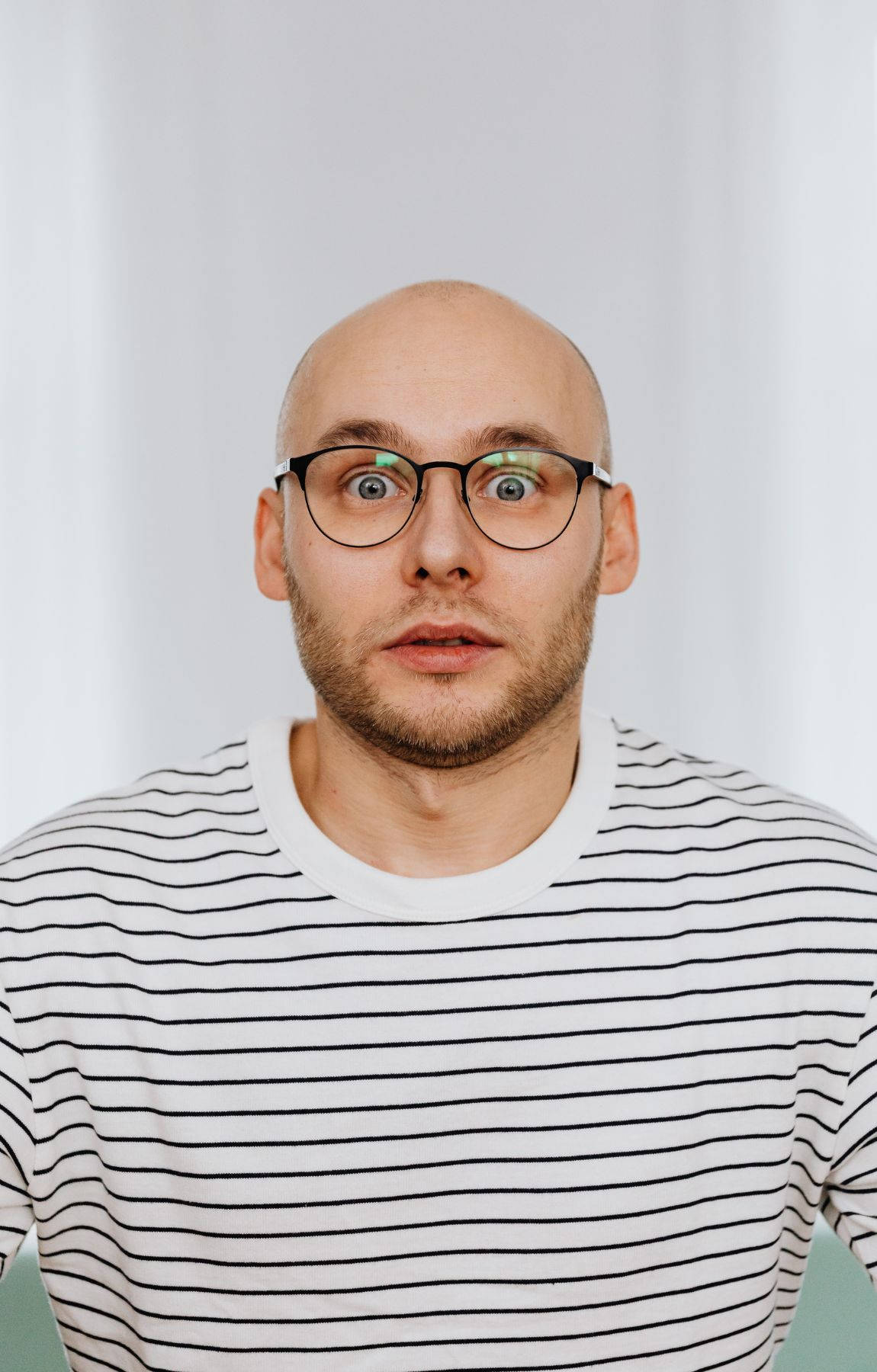 Bald Man With Wide Eyes Picture