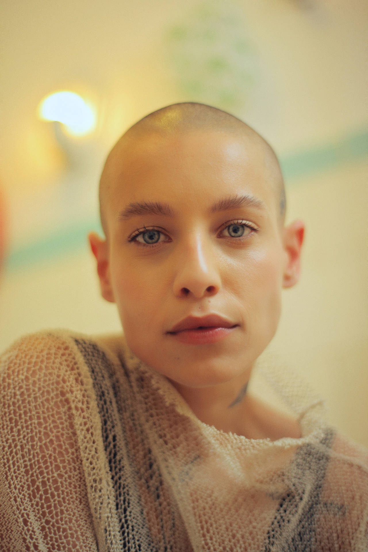 Bald Woman In Headshot Photo Wallpaper