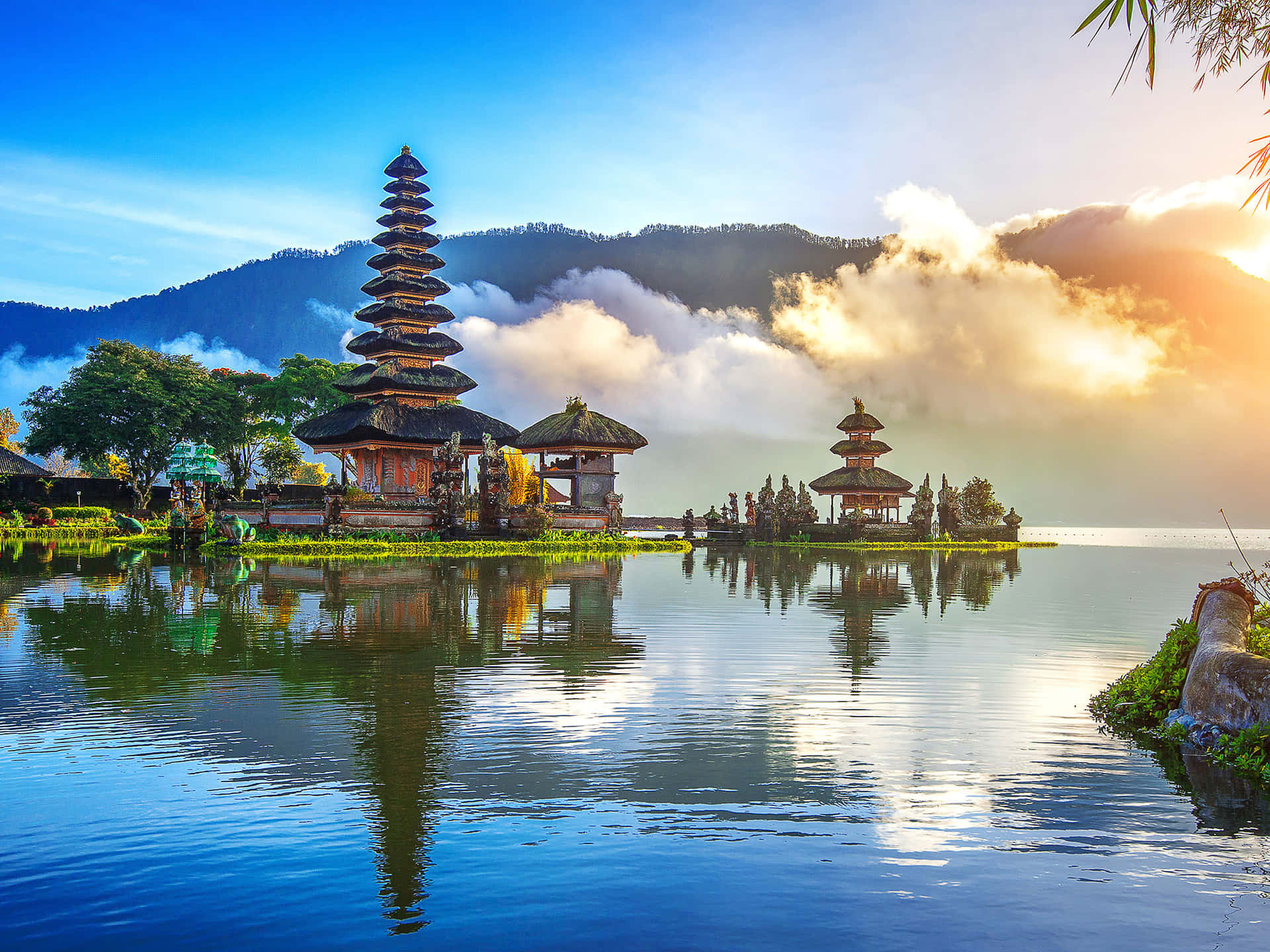 Sunrise Over A Lake With Temples In The Background