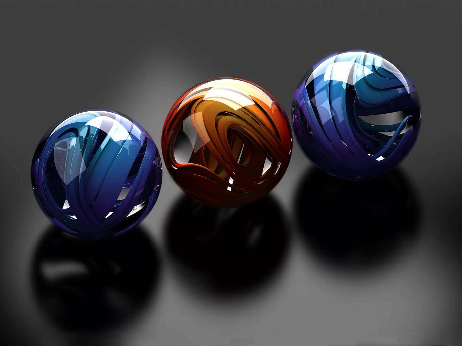 Three Colorful Balls On A Black Surface