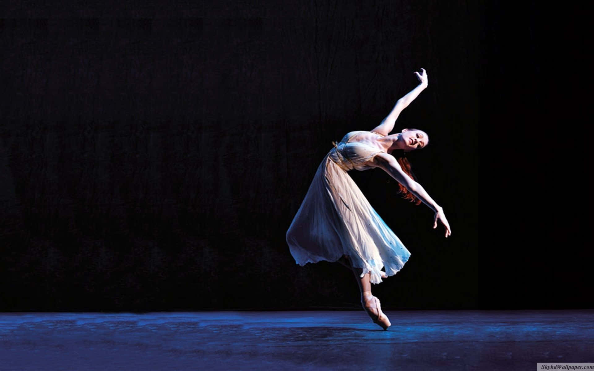 Fotografiadi Una Ballerina In Posizione Di Flessione Sfondo