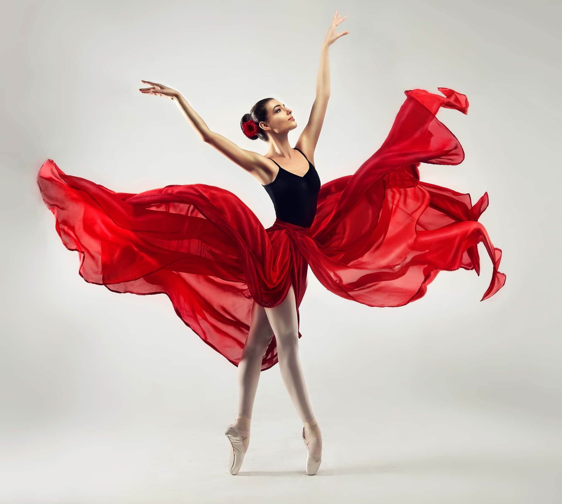 A Ballerina In Red Dress Posing