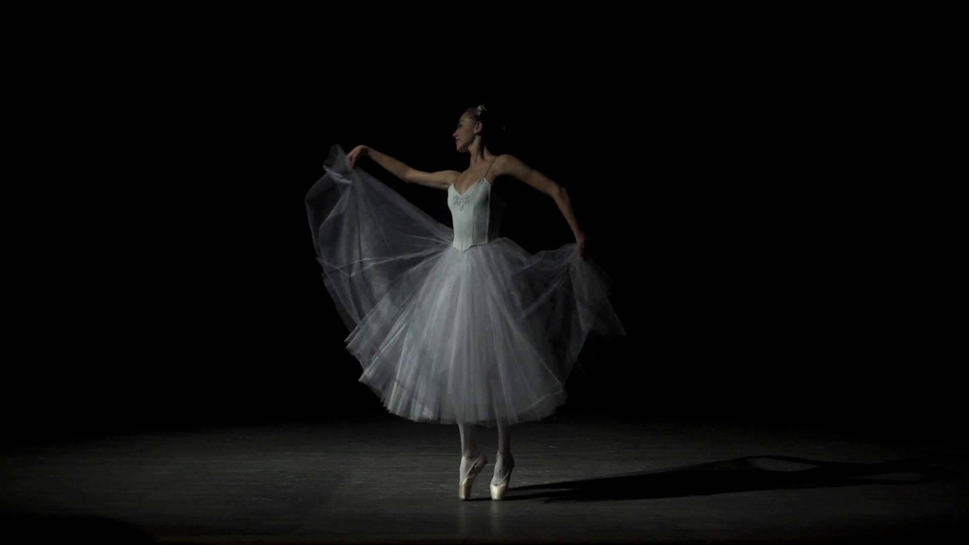 "Grace in Motion - Ballet Dancer in Exquisite Pose" Wallpaper