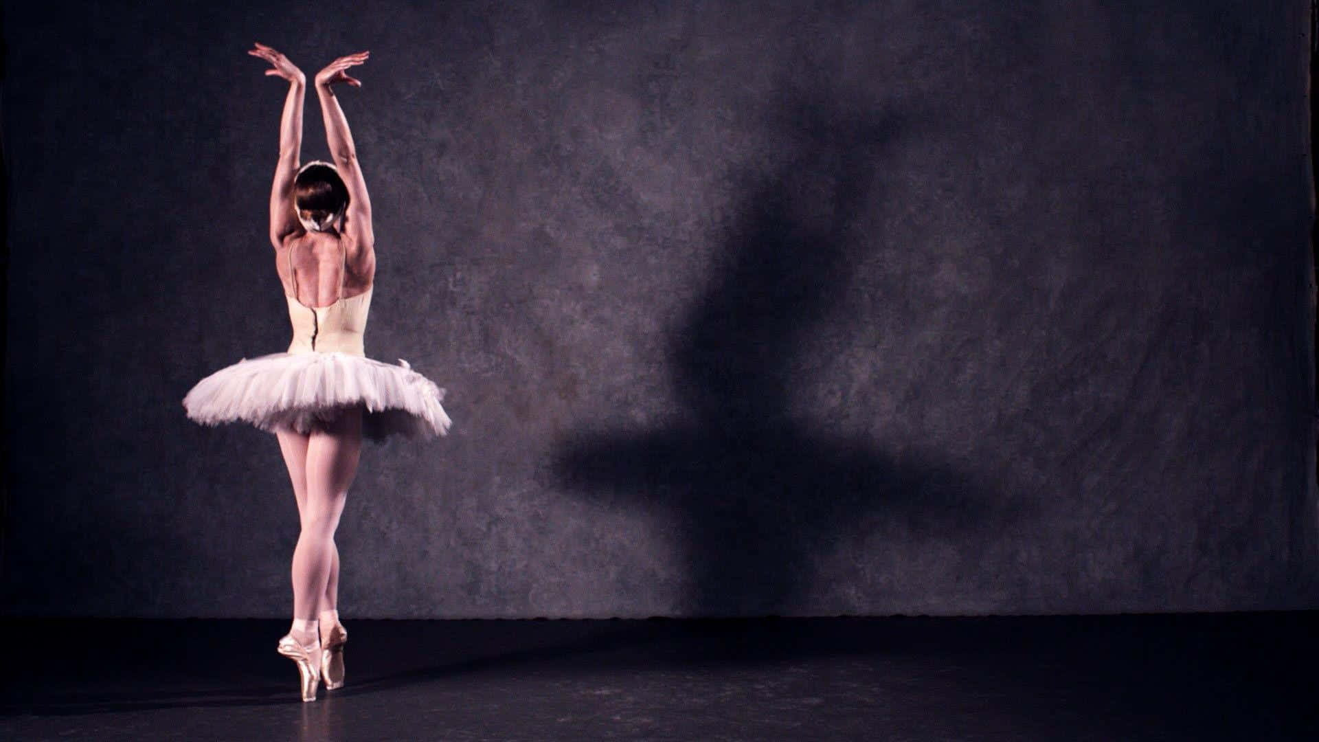 A graceful ballet dancer in mid-performance.