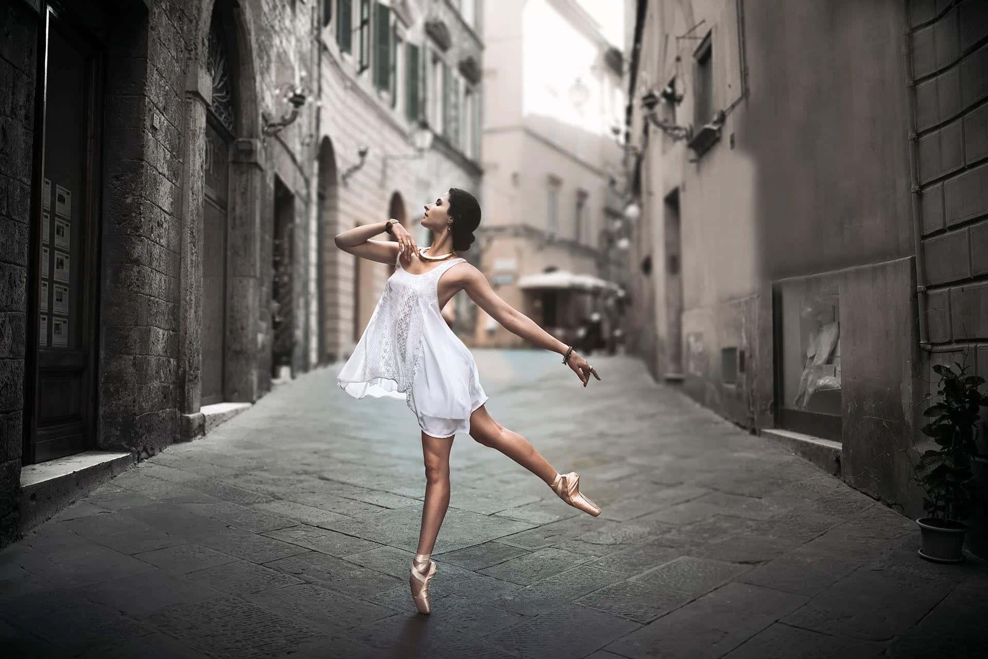 A Young Woman In A White Dress Is Jumping In An Alley