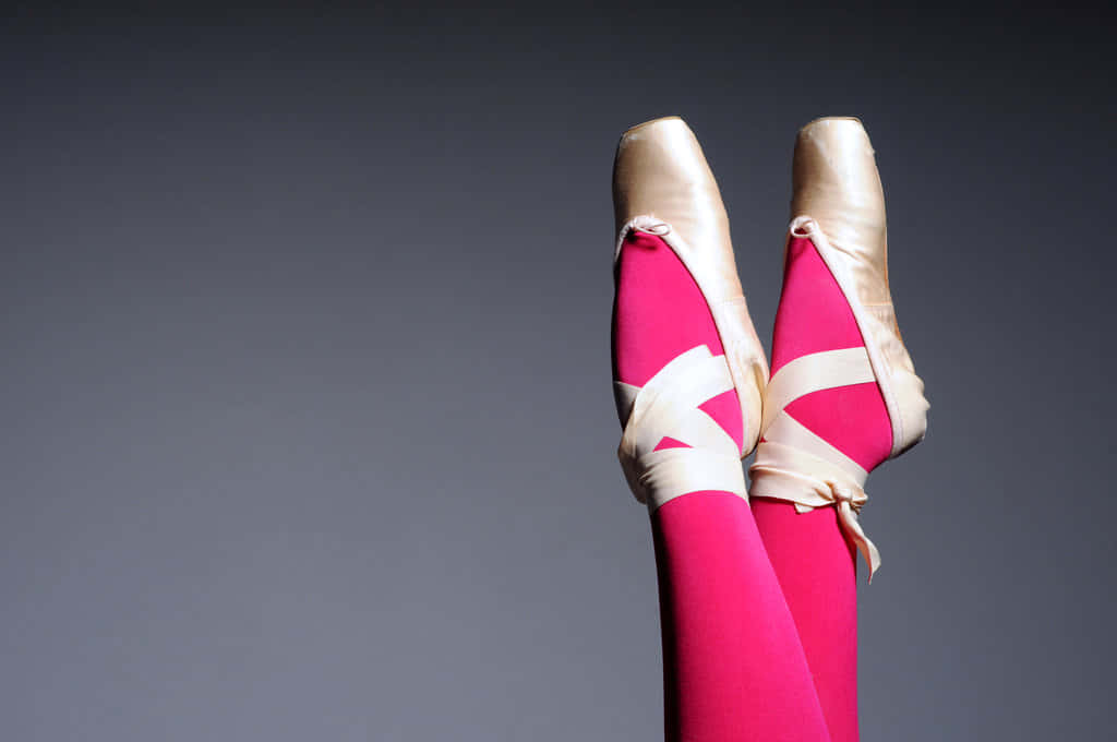 A Woman's Legs Are In Pink Ballet Shoes Wallpaper