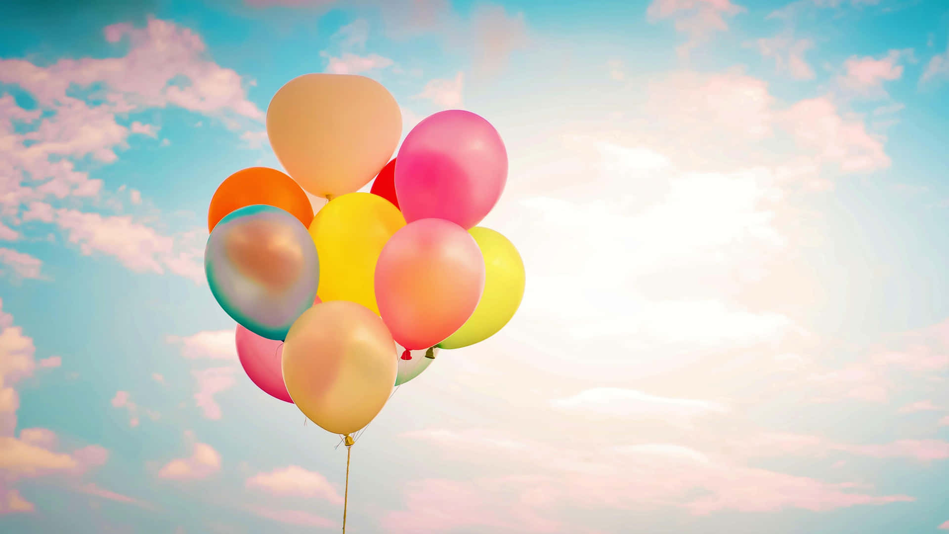 Colorful balloons make a beautiful display in the sky