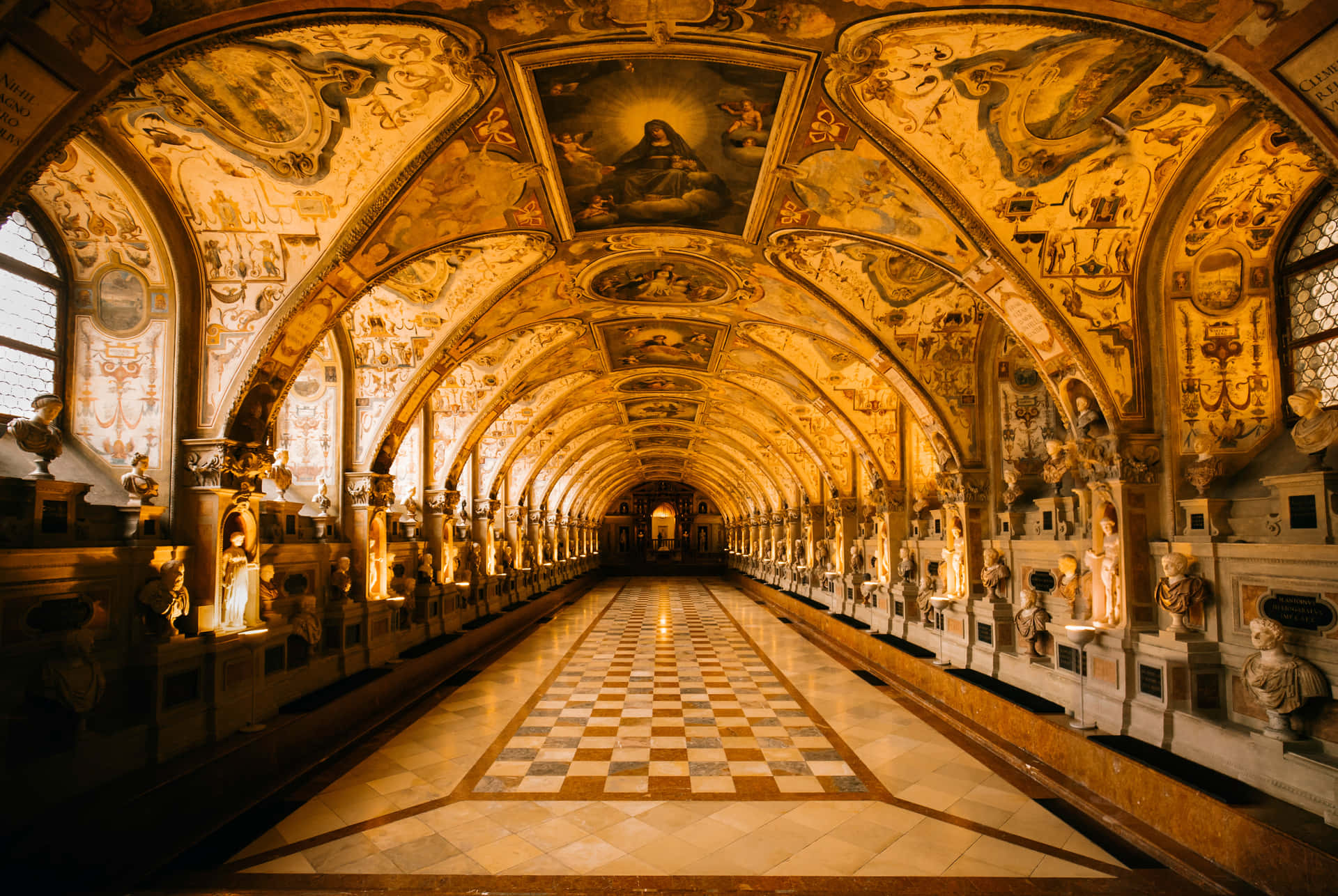 A Hallway With Ornate Paintings And A Checkered Floor