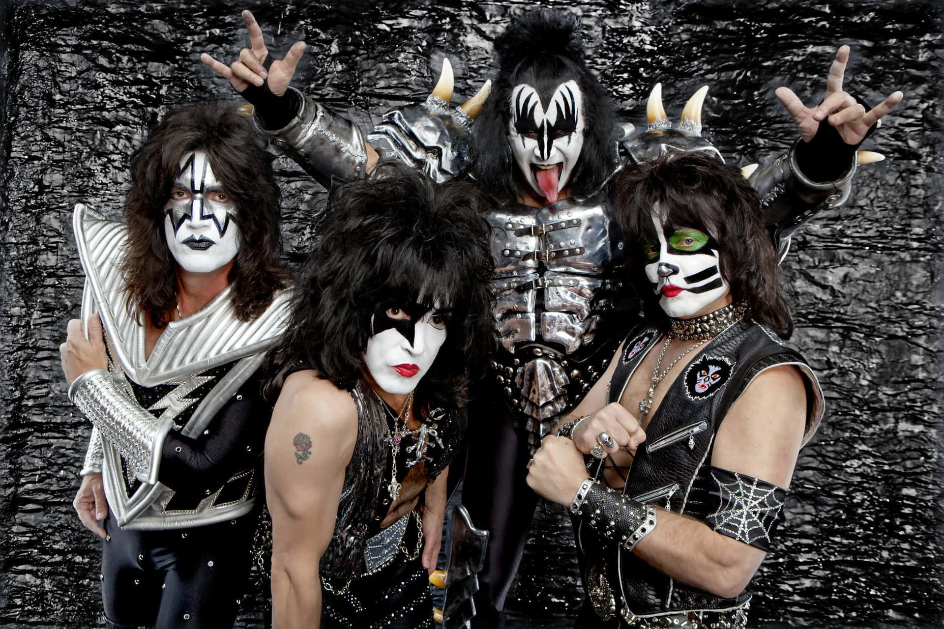 Kiss - A Group Of People In Black Makeup