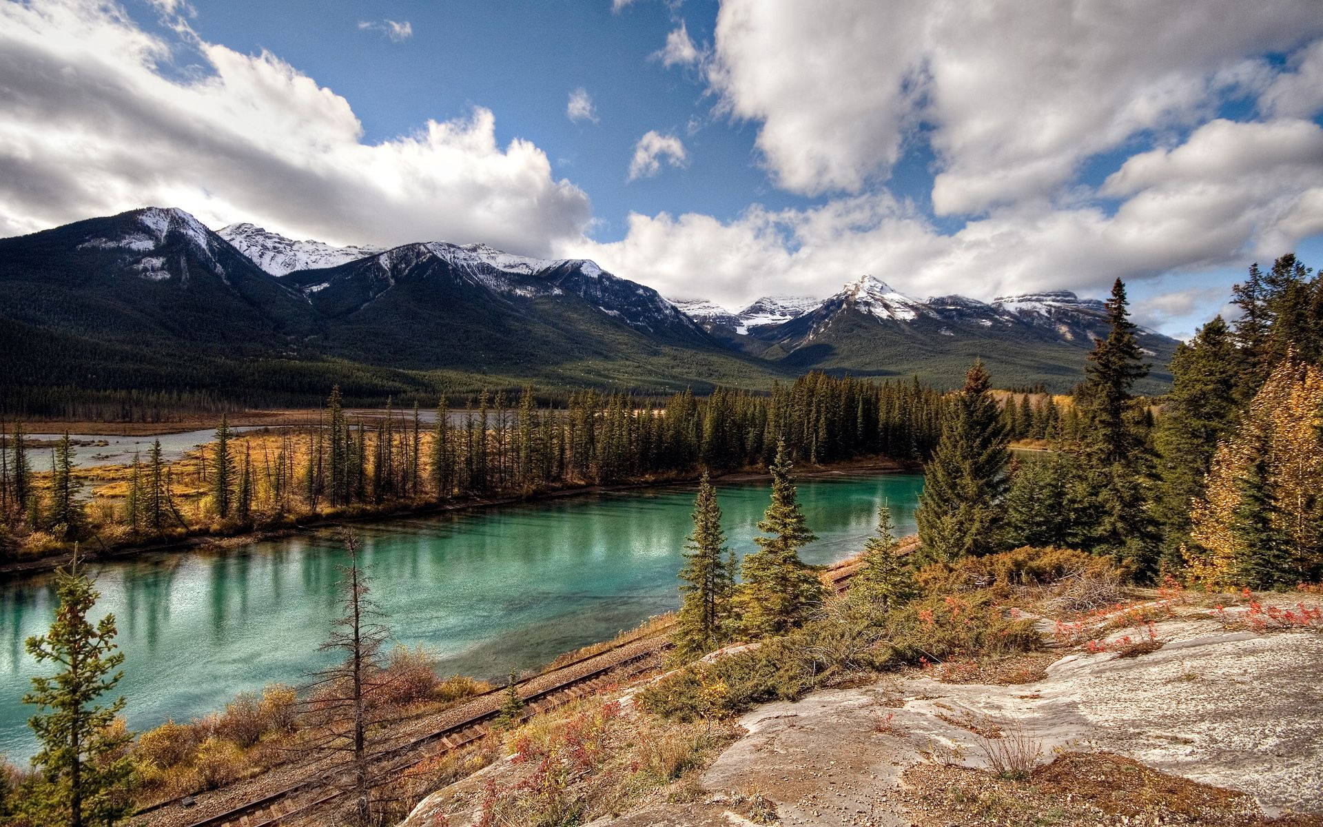A breathtaking view of the snow-capped mountains in Banff National Park - Wallpaper