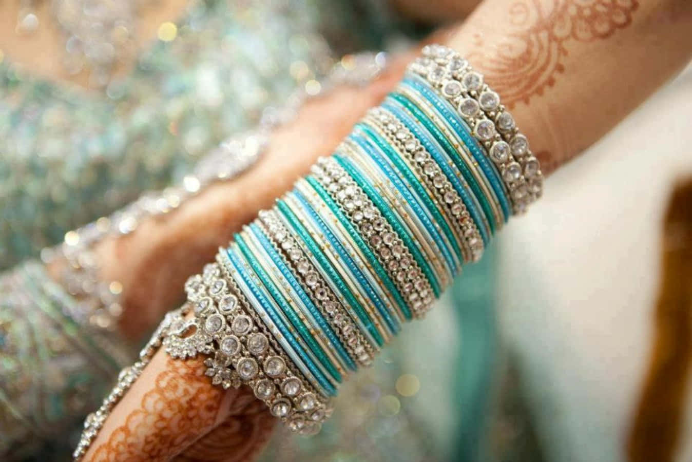 A Bride's Hand With Blue And Silver Bangles