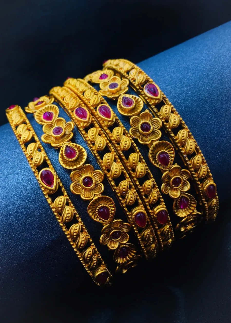 Gold Bangles With Red Stones