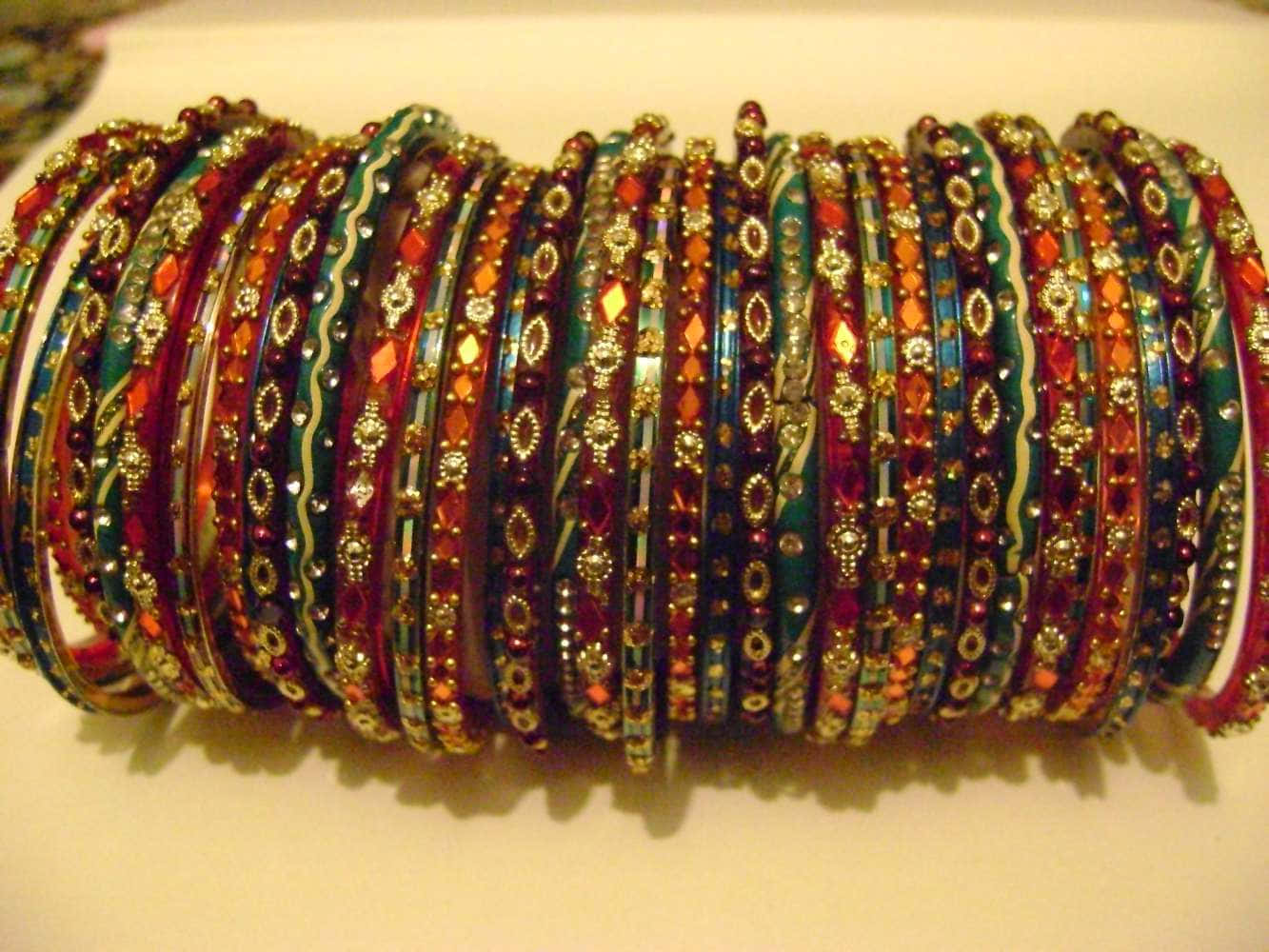 A Stack Of Colorful Bangles On A Table