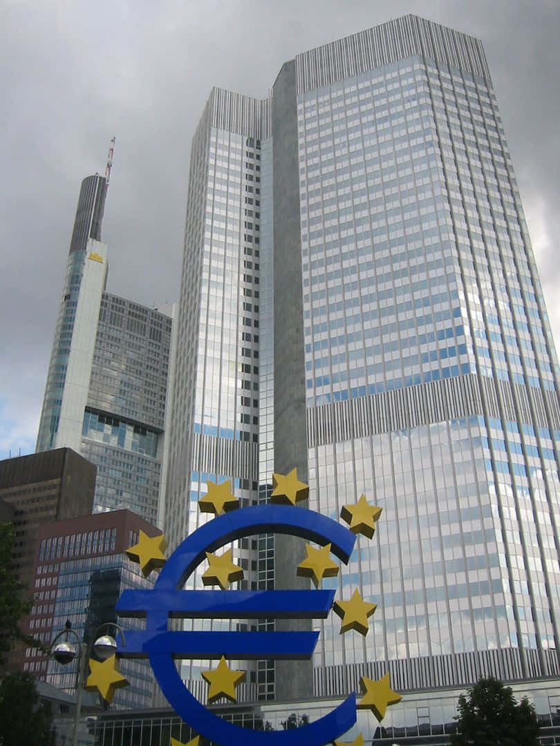 A Large European Sign Is In Front Of A Building