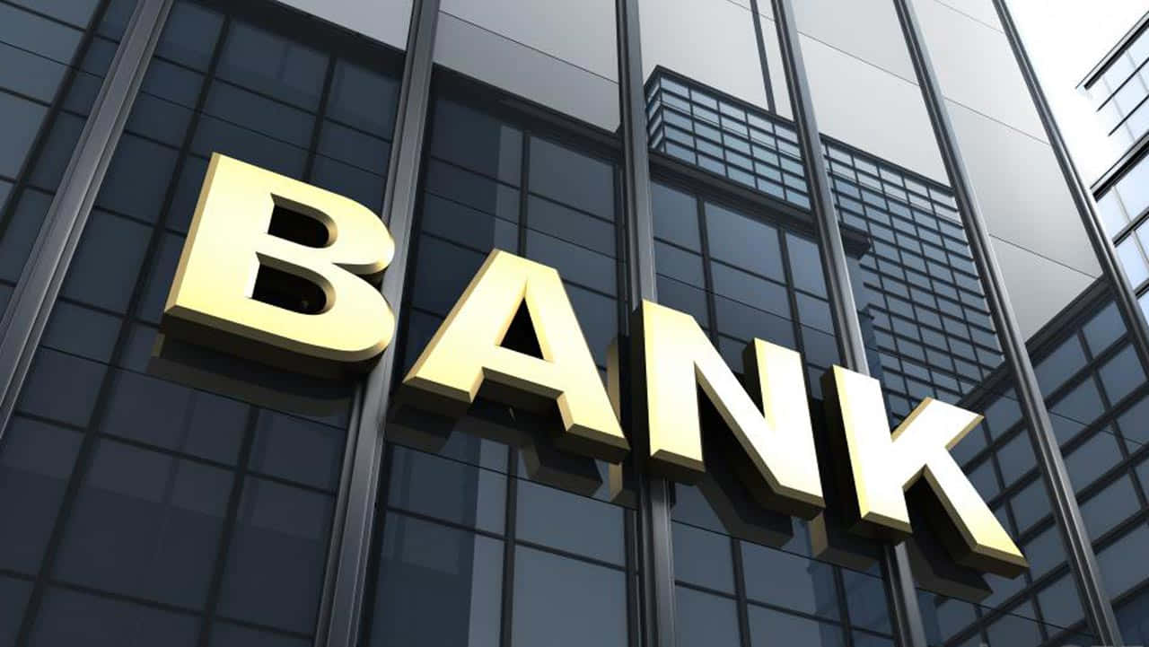 Bank Sign On A Building With Buildings In The Background