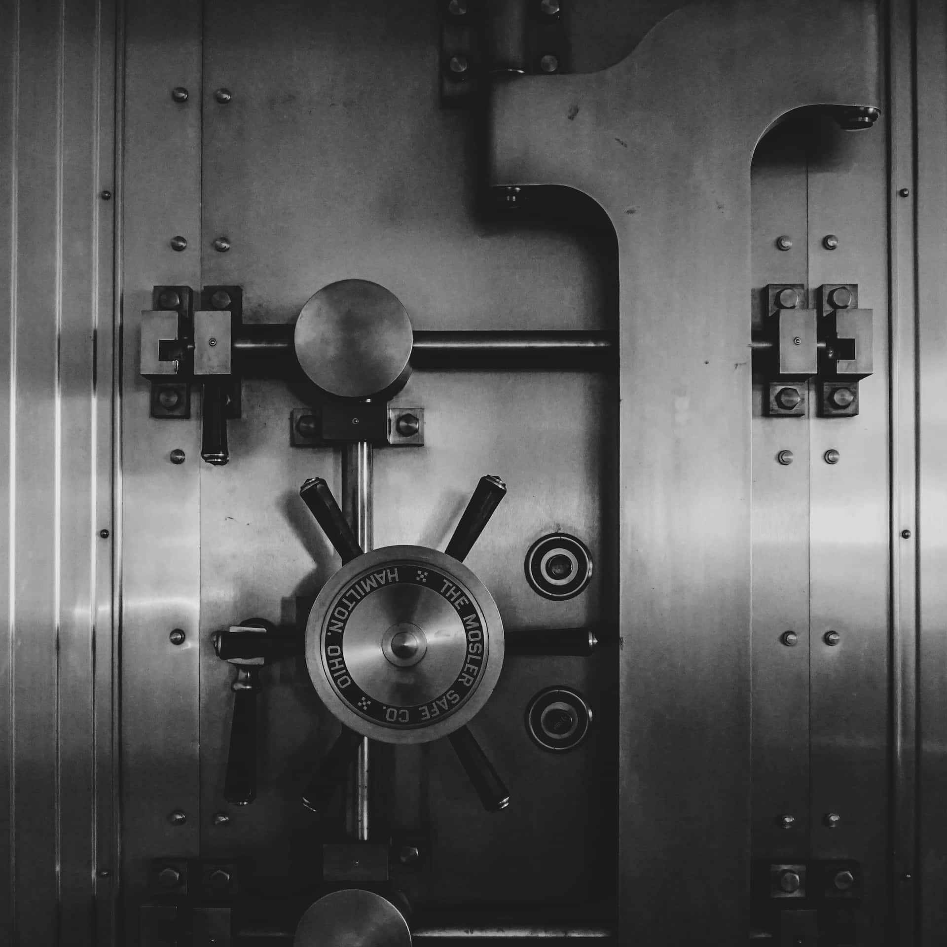 A Black And White Image Of A Bank Vault