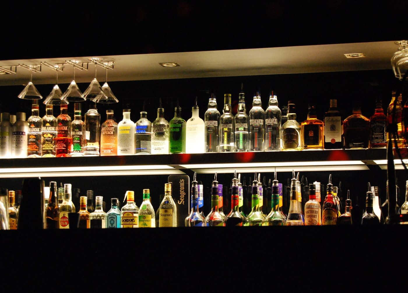 A Bar With Many Bottles Of Liquor