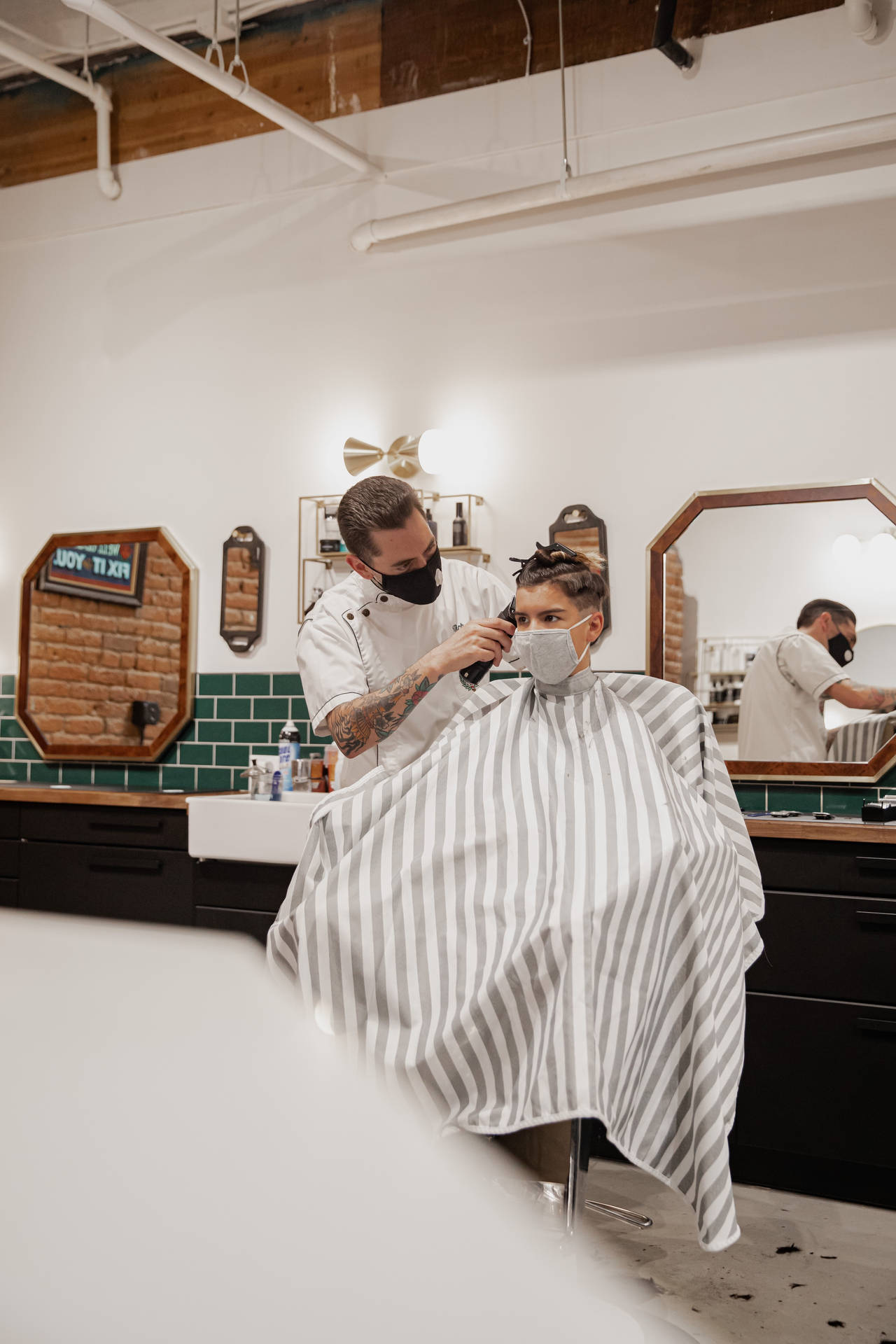 Barber Doing Haircut On Client
