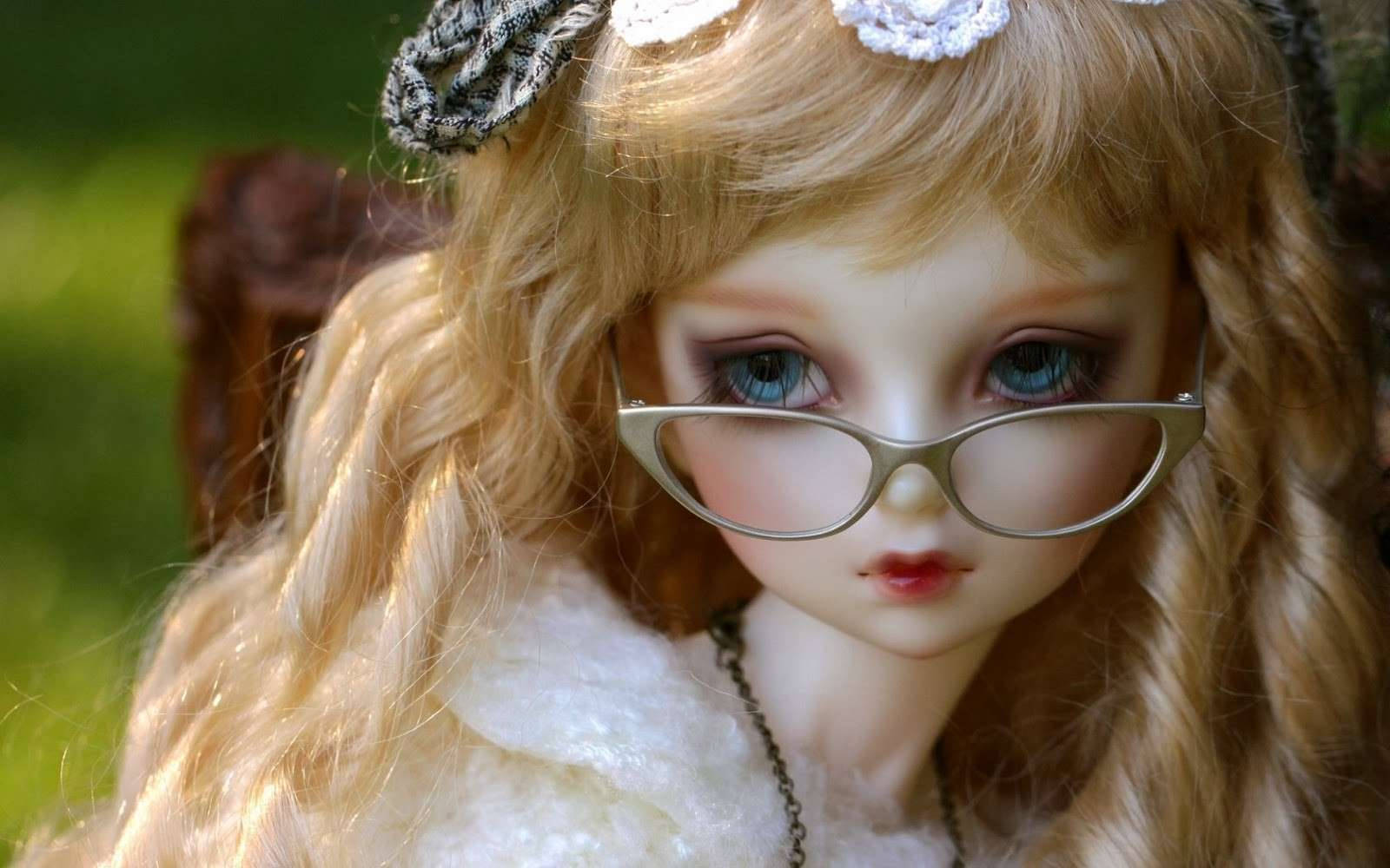 Download Barbie Doll With Cat Eye Glasses Wallpaper | Wallpapers.com