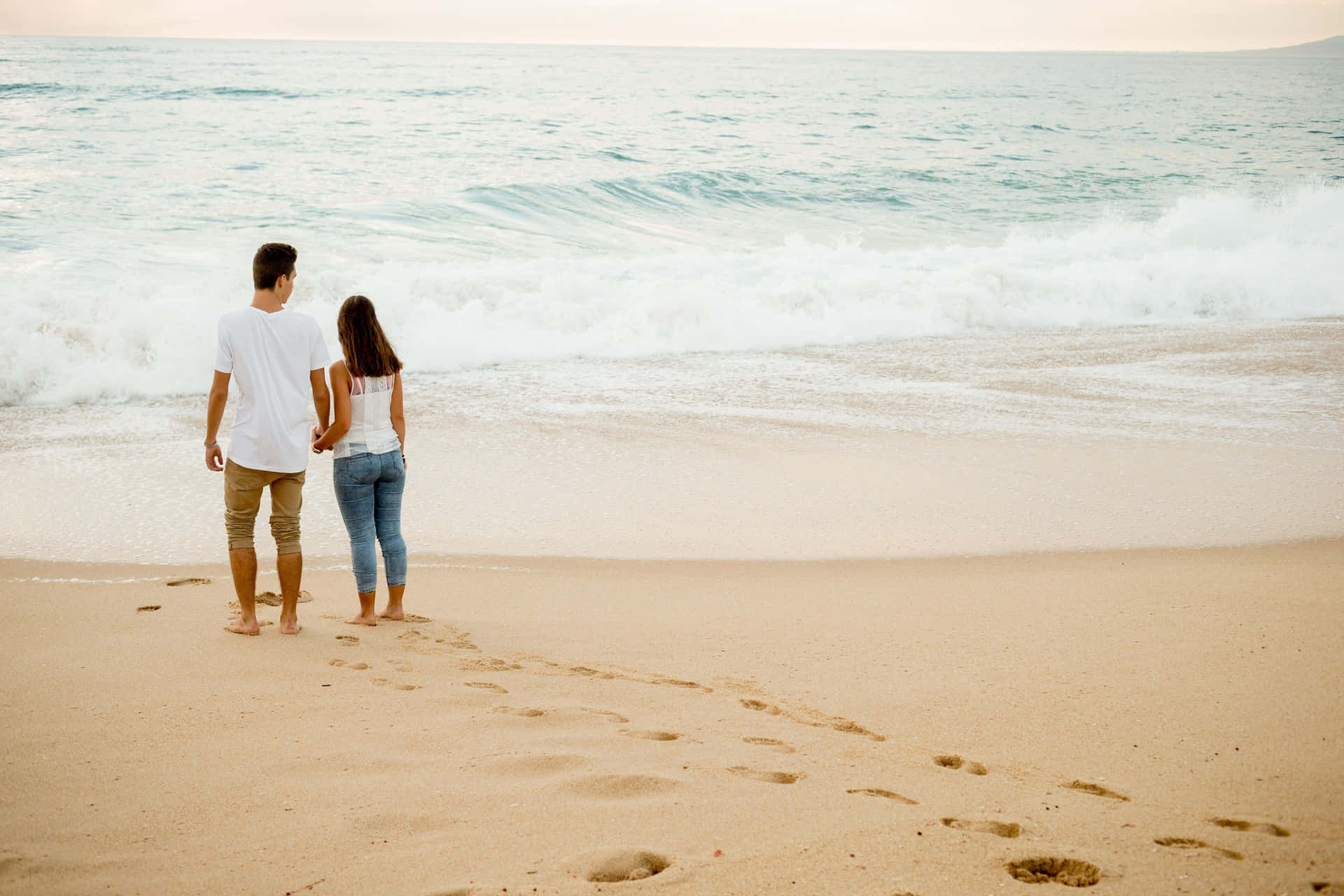 Barefoot Couple At Beach Waves Wallpaper