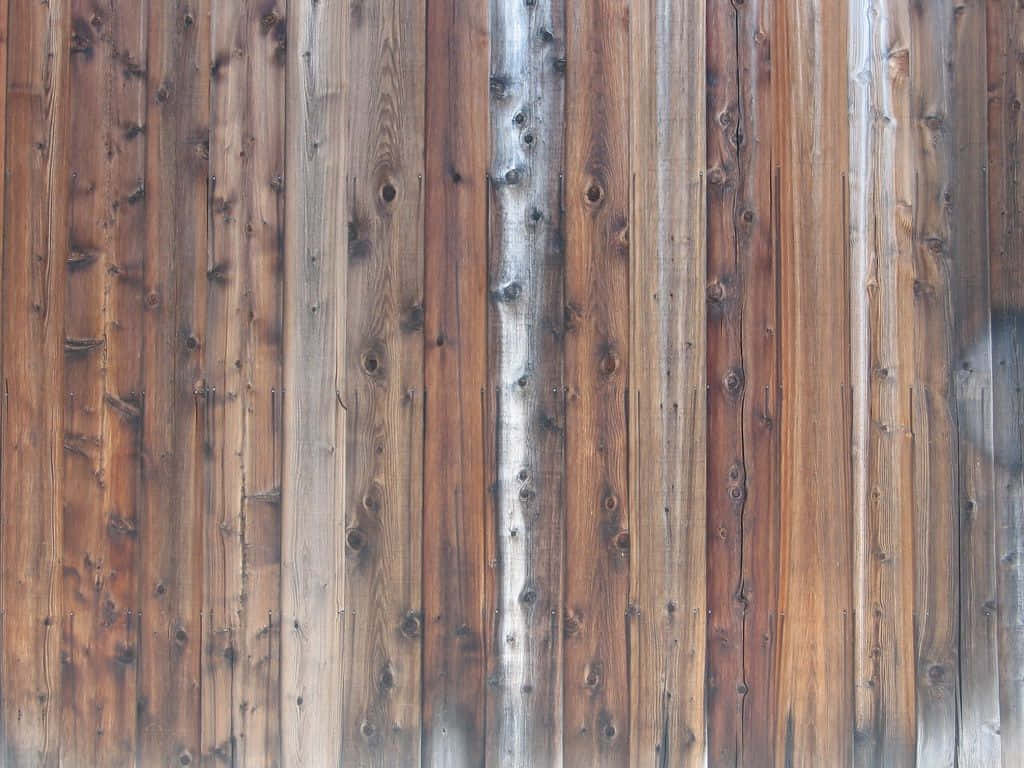 A view of weathered barn wood planks Wallpaper