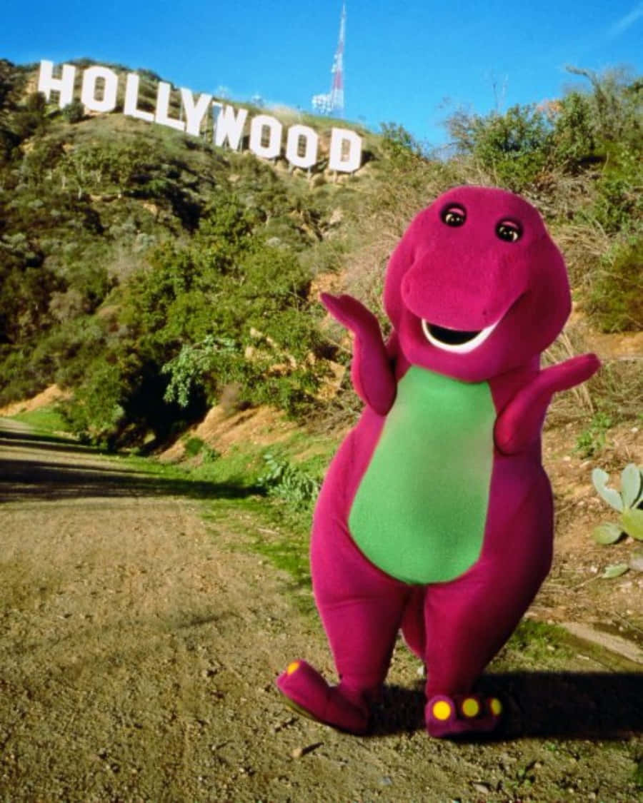 Image  Child joyfully playing with Barney the dinosaur.