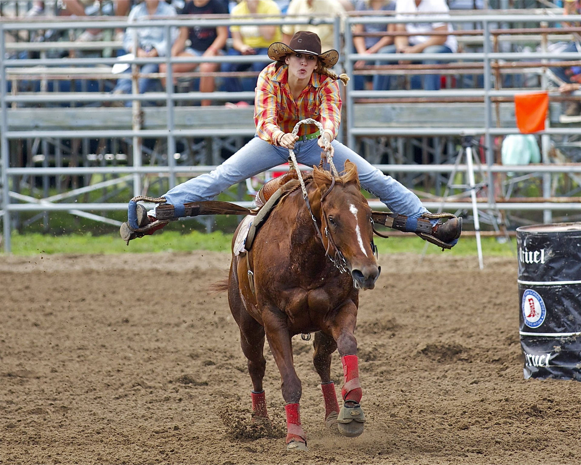 An electrifying moment of barrel racing in action Wallpaper