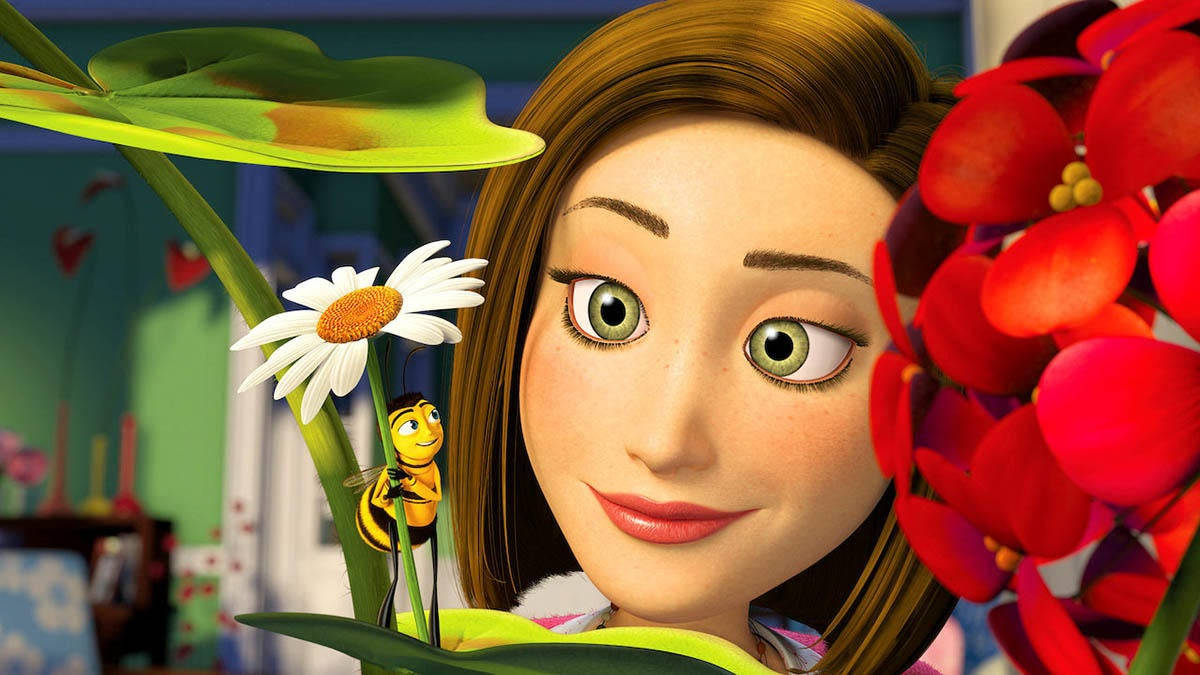 a girl is looking at flowers Wallpaper
