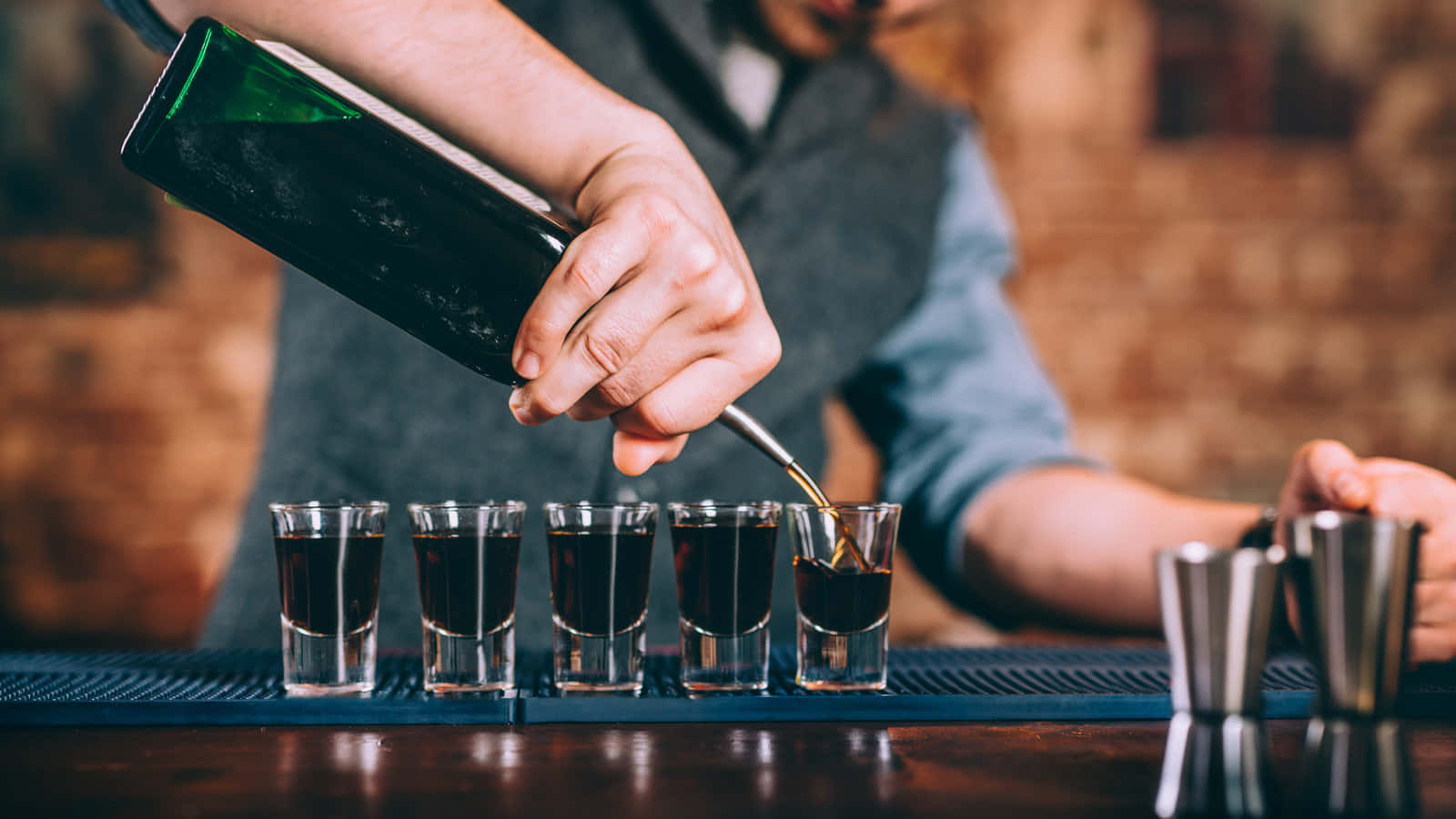 Bartender Pouring Shots Wallpaper