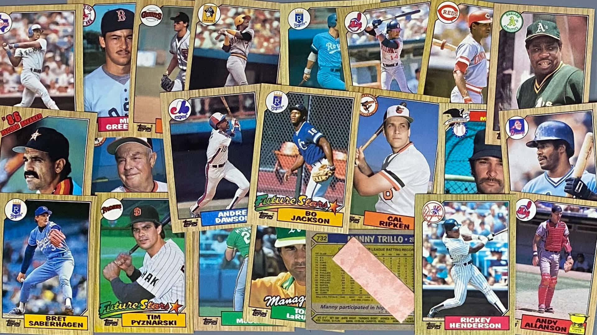 A collection of vintage baseball cards featuring legendary players Wallpaper
