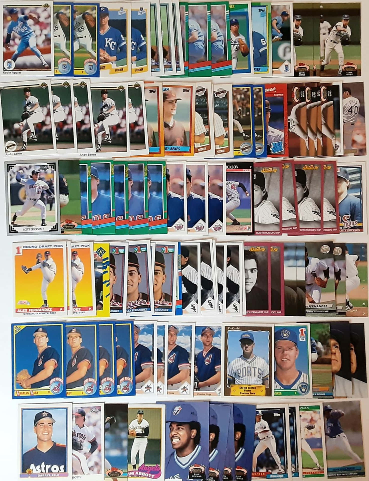 An assortment of vintage Baseball Cards featuring iconic players Wallpaper