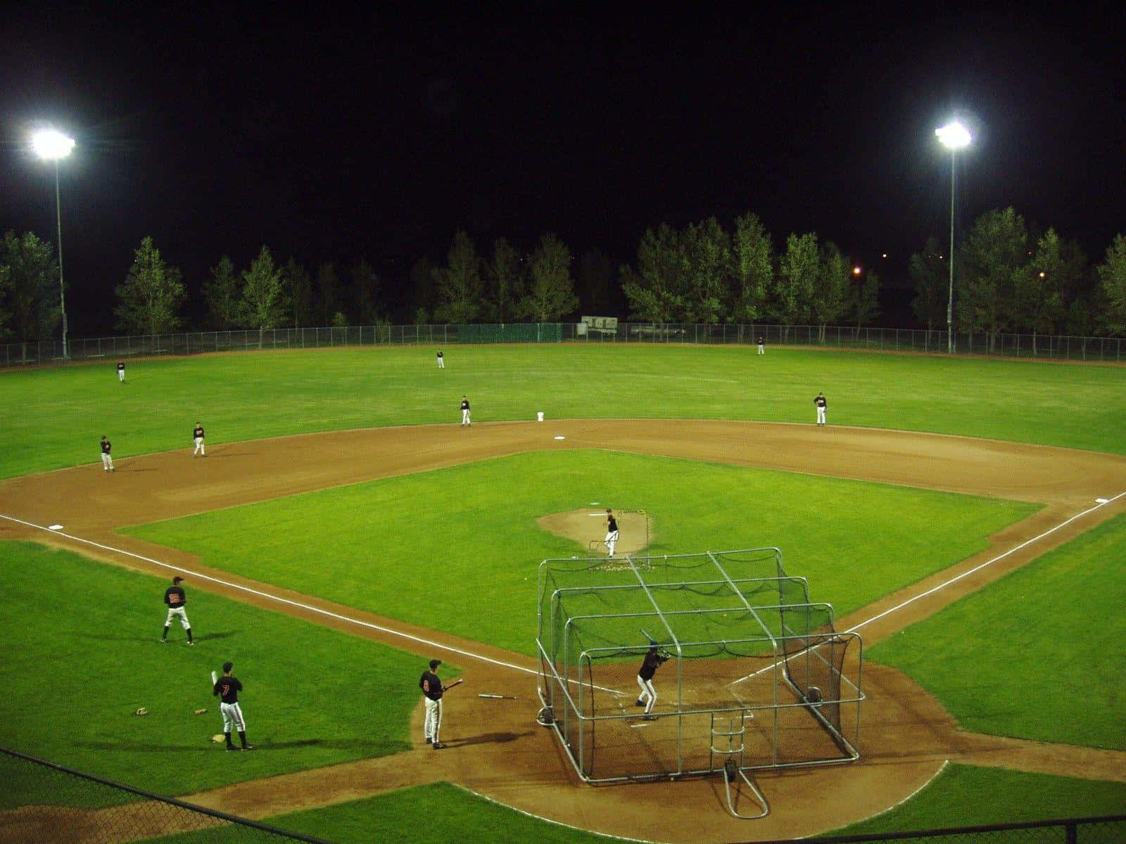 Green Baseball Field And Baseball Players Background