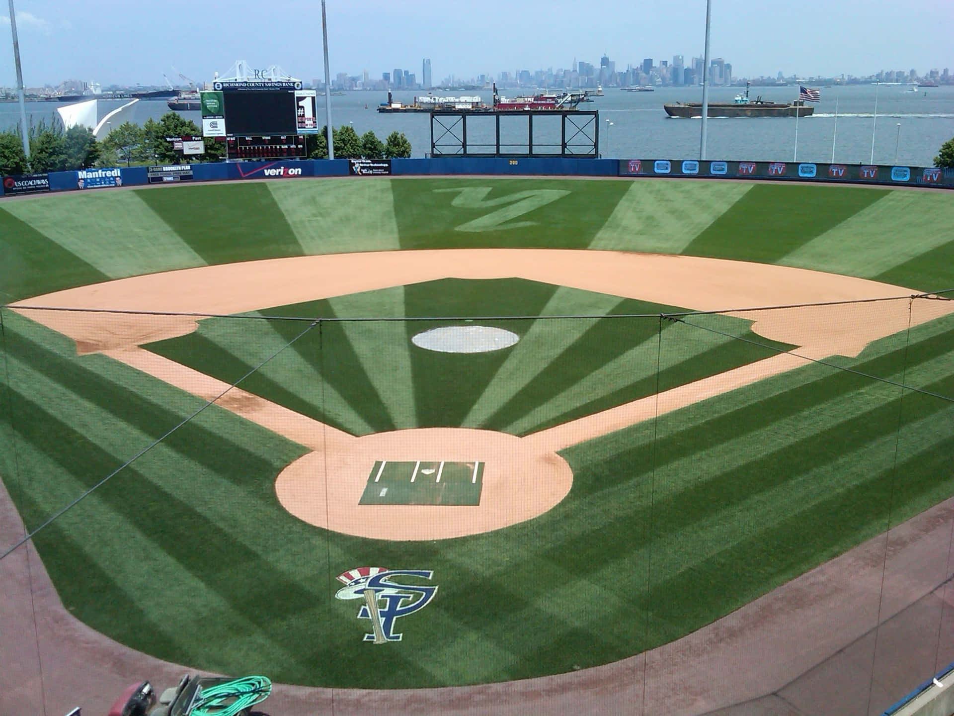 A Baseball Field With A Green Field