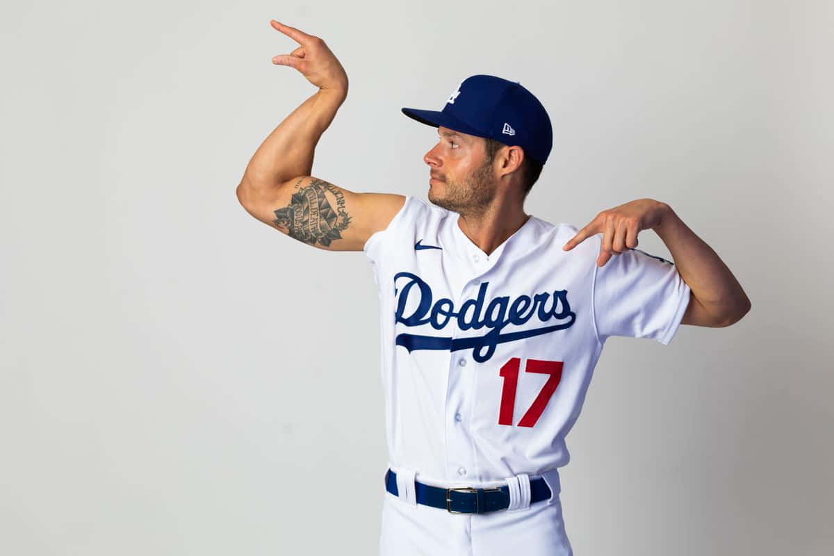 Baseball Player Showing Musclesand Tattoo Wallpaper