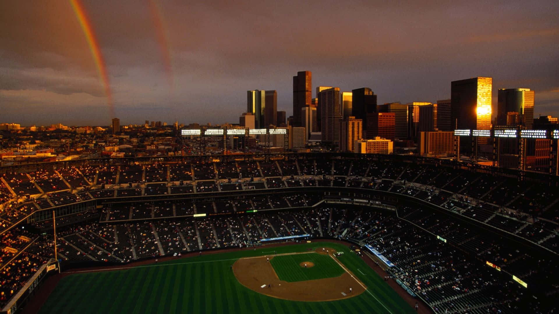 A Stunning View of a Baseball Stadium Filled with Cheering Fans Wallpaper