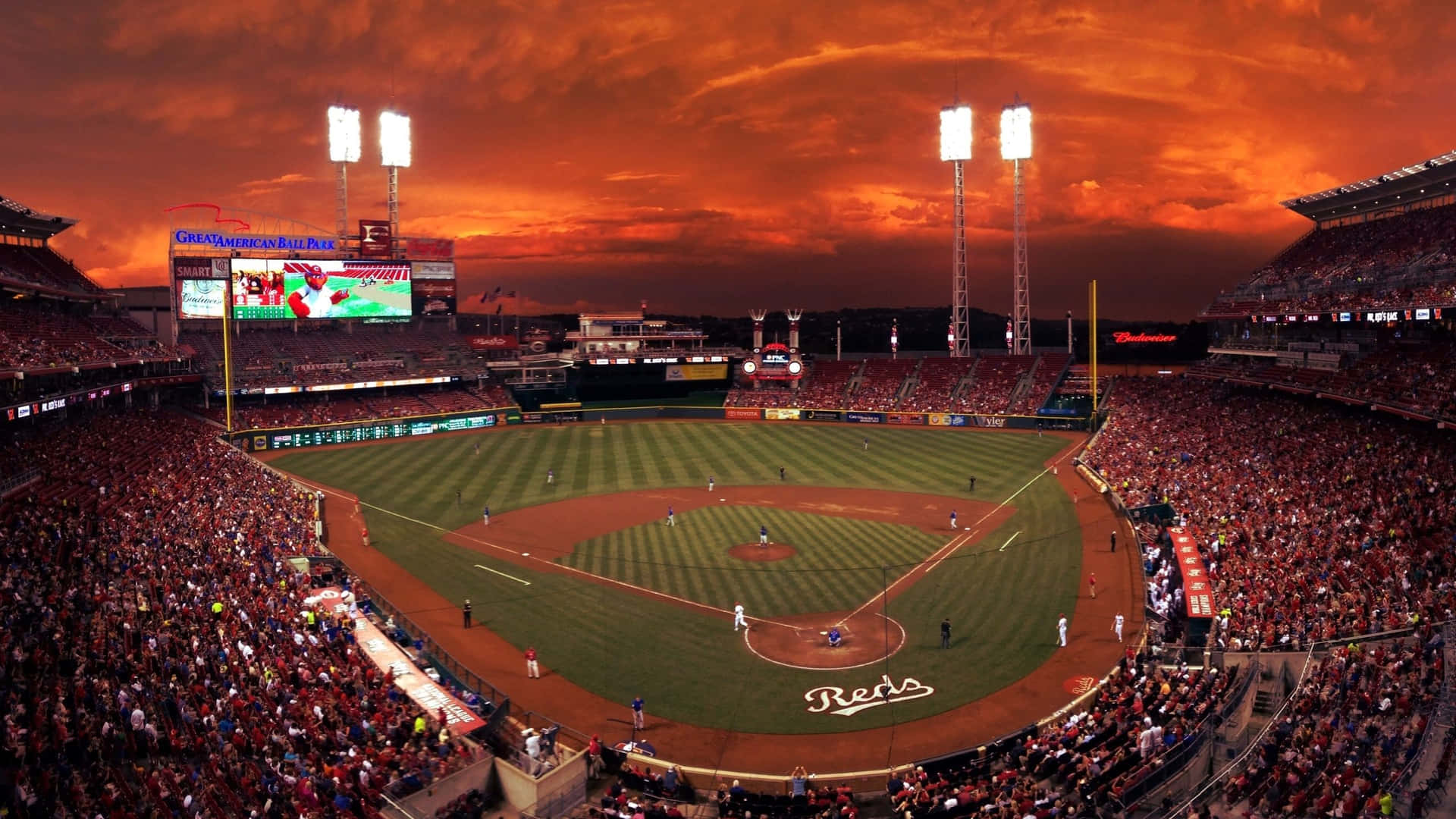 Majestic Baseball Stadium Under a Vibrant Sky Wallpaper
