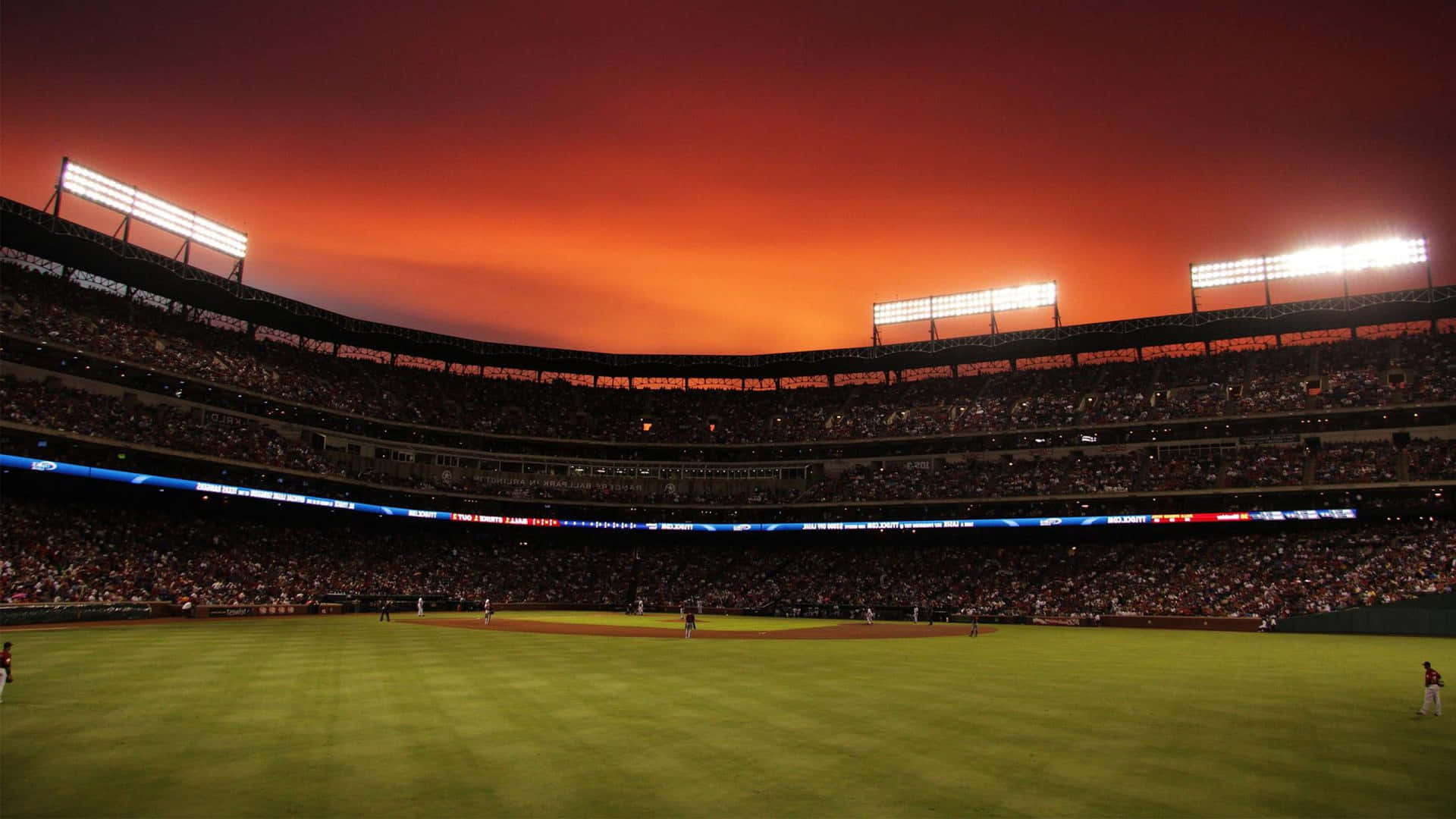 A Stunning Baseball Stadium at Sunset Wallpaper