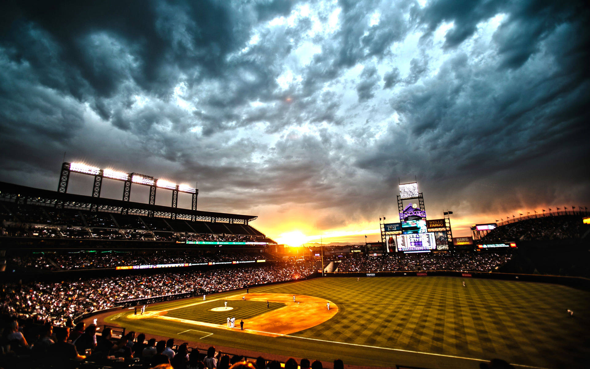 A stunning view of a baseball stadium at sunset Wallpaper