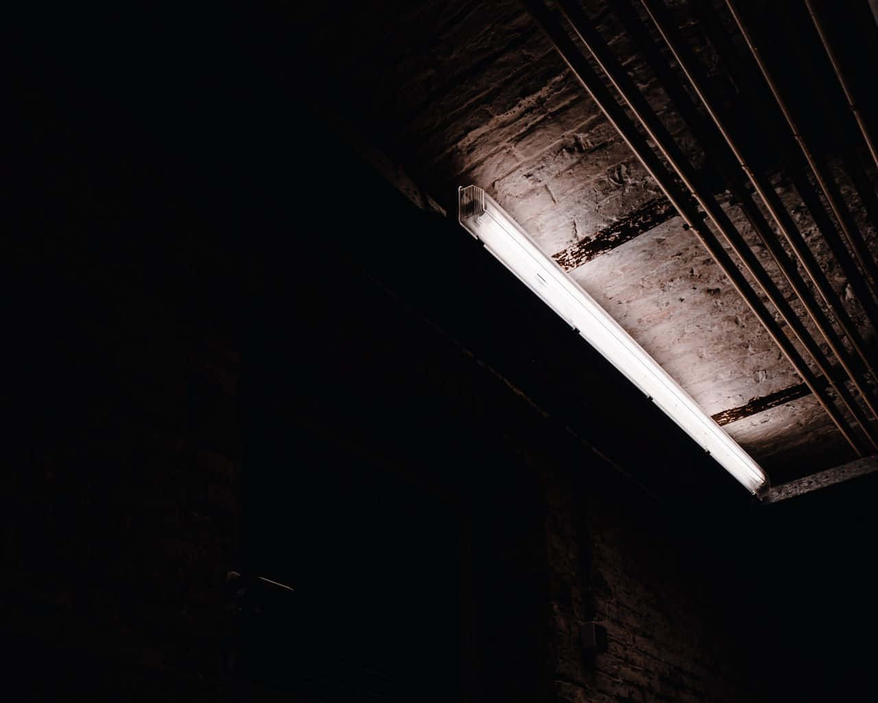 A Light Is Shining On A Brick Wall